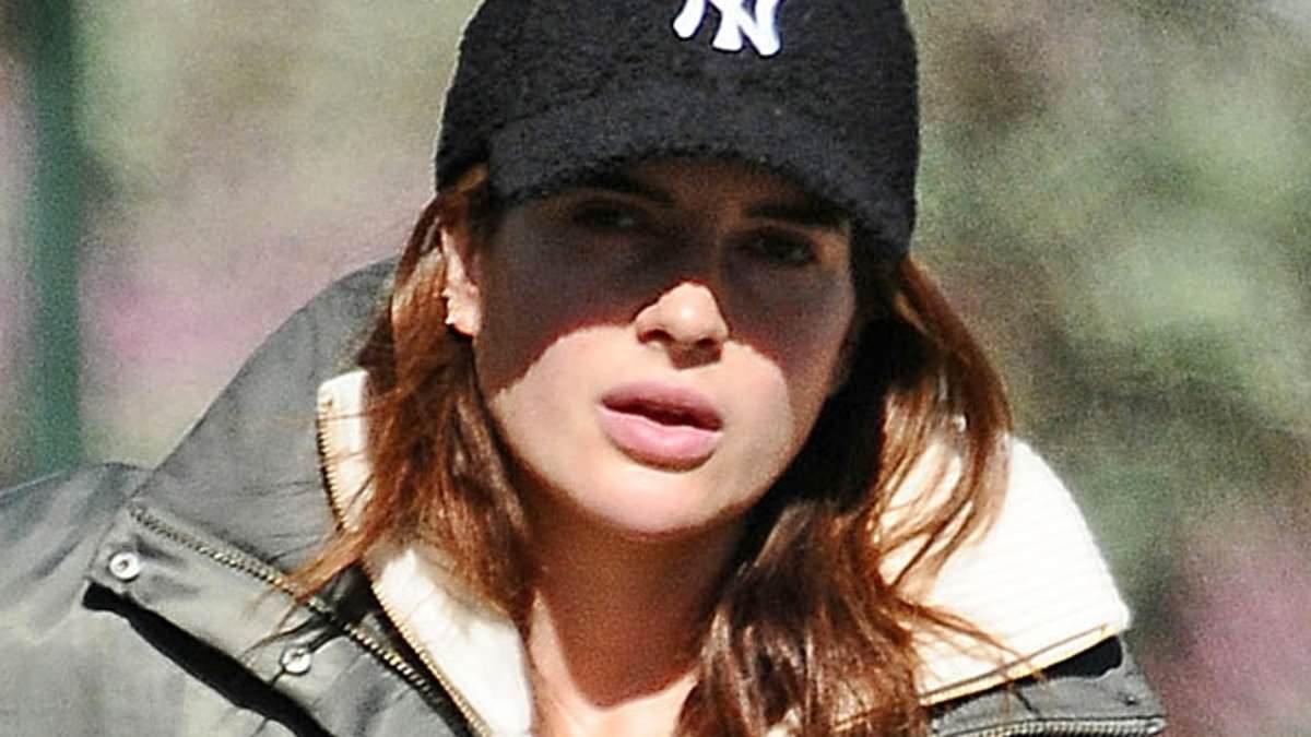Binky Felstead shrugs off 'humiliating' freebie row drama as she breaks cover for a coffee run and dog walk with a pal