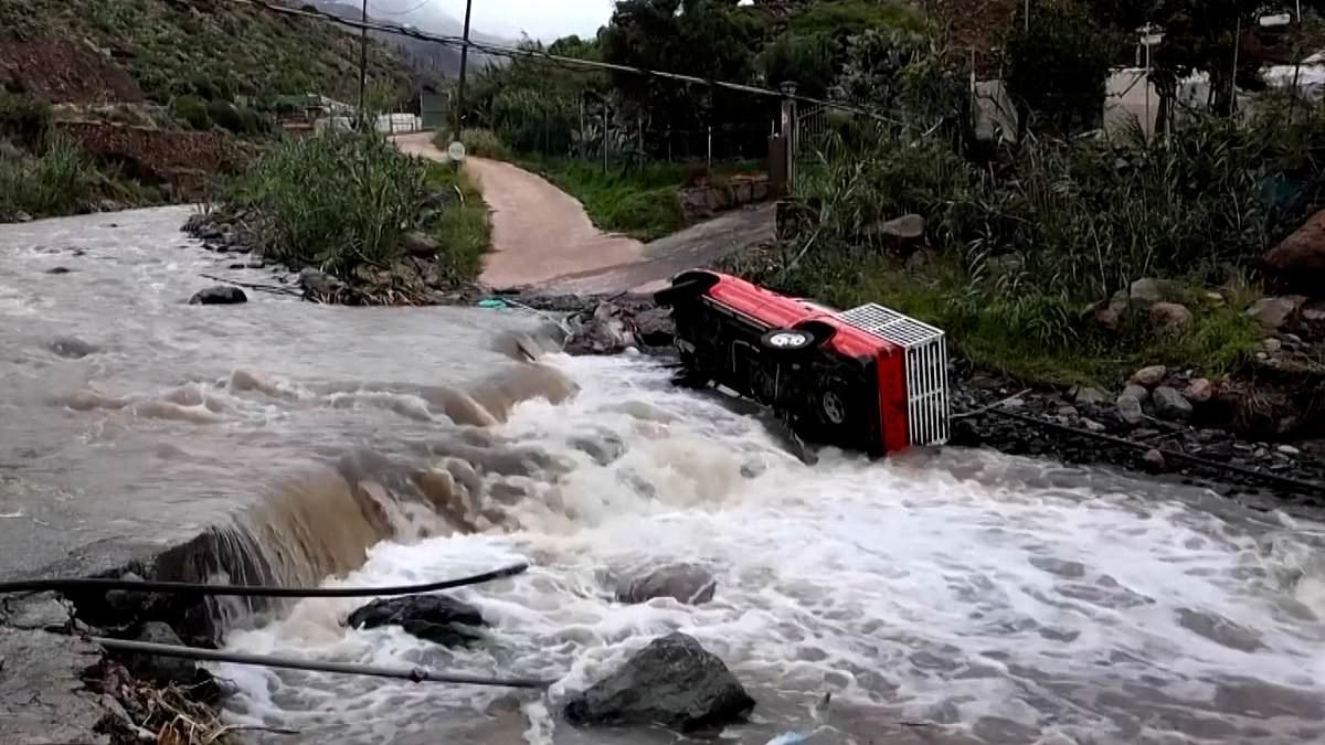 Canary Islands plead for military help amid mounting storm chaos: Dams 'close to overflowing' and villages cut off as video shows jet abort landing at last second in howling winds