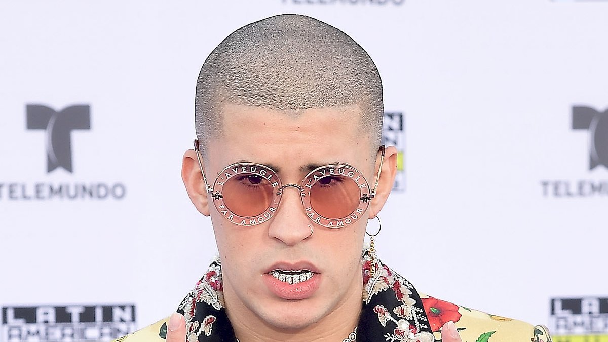 Bad Bunny fans marvel at his 'immaculate' A-list transformation from geeky skinhead to handsome hunk after making history with Album of the Year Grammy win