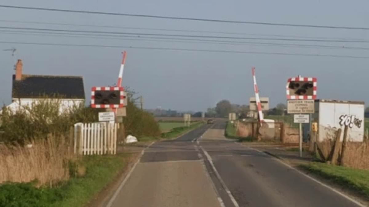 Person dies and another is injured after train crashes into car at level crossing