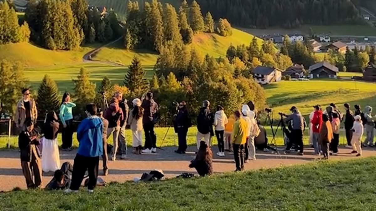 The picture-perfect Alpine village waging war on tourists: Italian hamlet installs barriers to stop hordes of selfie-hunting holidaymakers after fed-up locals started attacking visitors