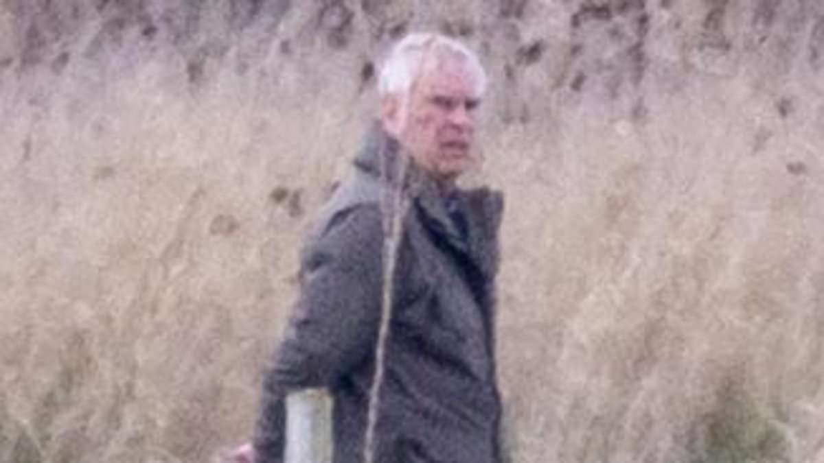 Scowling Andrew Mountbatten-Windsor looks a world away from Royal life walking his dogs in wasteland - the day before King and Queen make Easter church visit with family
