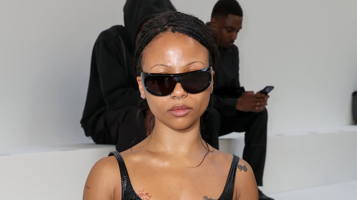 Industry star Myha'la ditches the boardroom gear and flashes her abs in a PVC bra at the Courreges PFW show with her husband Armando Rivera after explosive season four finale