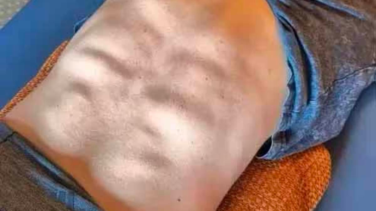 US Olympic star Mikaela Shiffrin shows off incredible six-pack... on her BACK