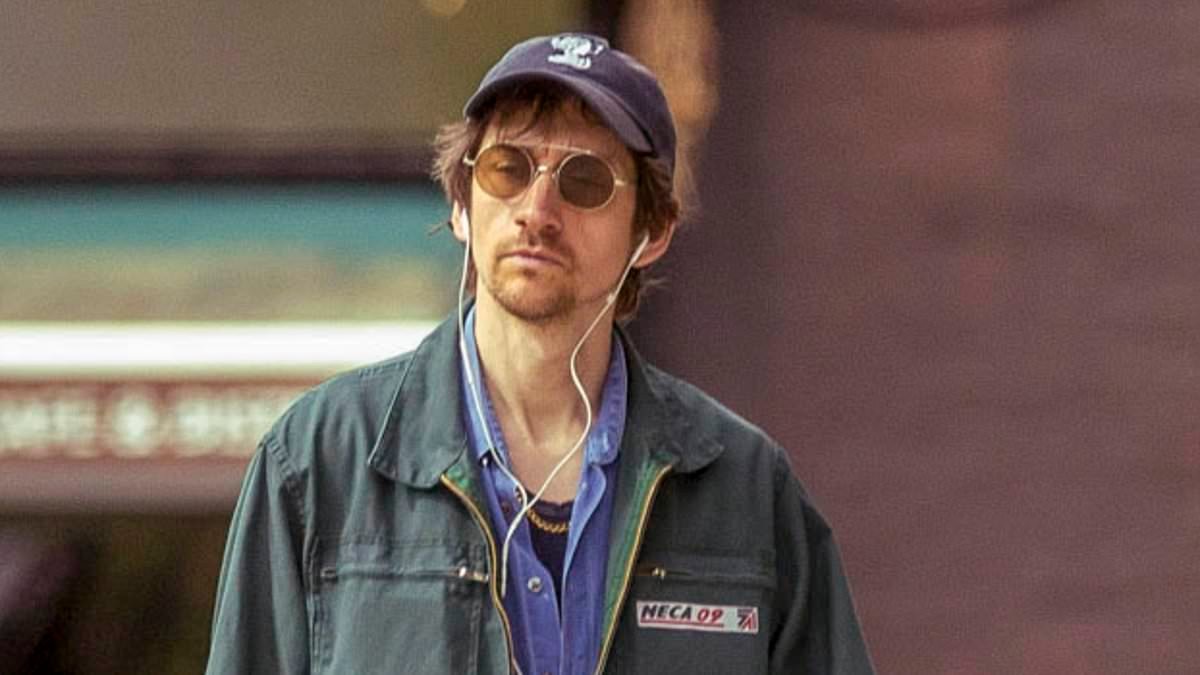 Legendary indie rocker looks unrecognisable as he makes incognito outing - can YOU guess who it is?