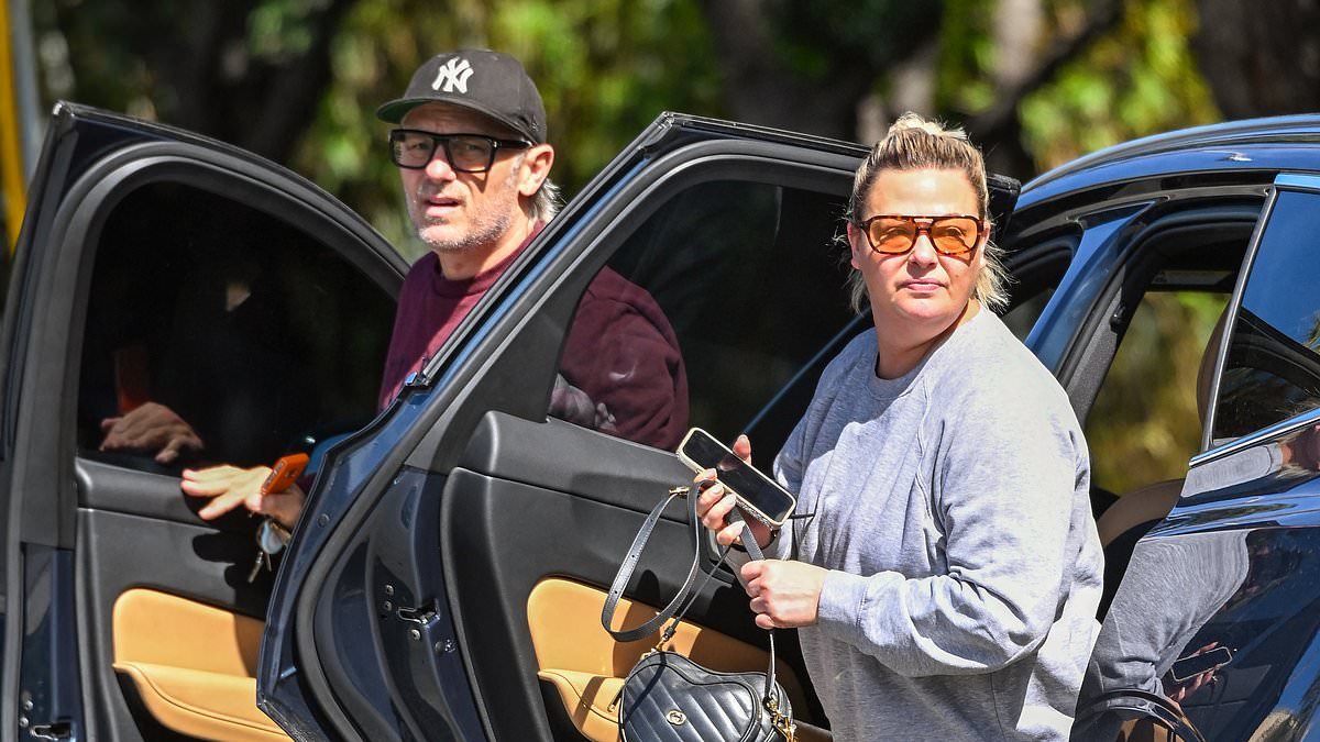 Lisa Armstrong reunites with former Deuce bandmate Craig Robert Young and his husband after flying to Los Angeles as she grieves the death of beloved dog Hurley