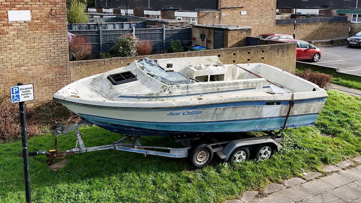 Furious residents demand action after boat called 'Just Chillin' is dumped on their street and left to rot for three months