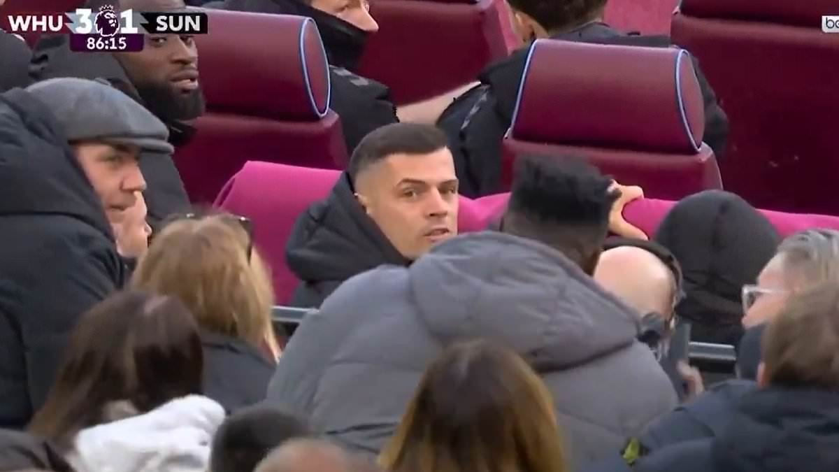 Granit Xhaka gets into heated argument with West Ham fans behind the bench (when he's not even playing!)