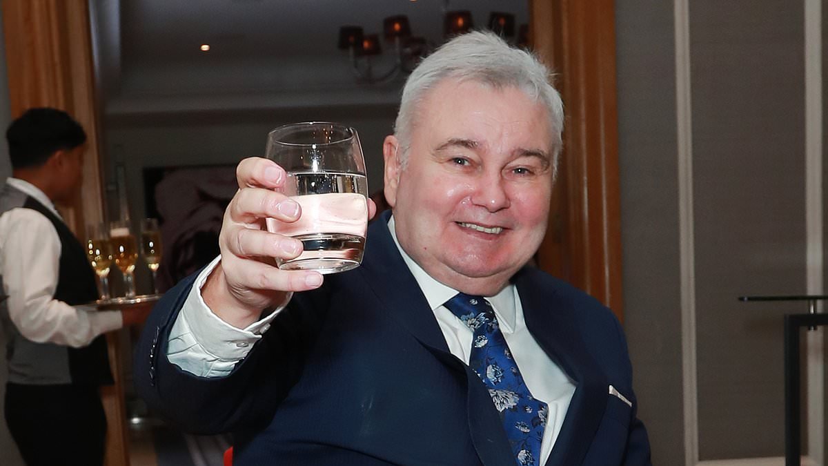 Eamonn Holmes, 66, poses in his wheelchair after detailing his ongoing health battle as he joins glam Elizabeth Hurley at Cancer Research event
