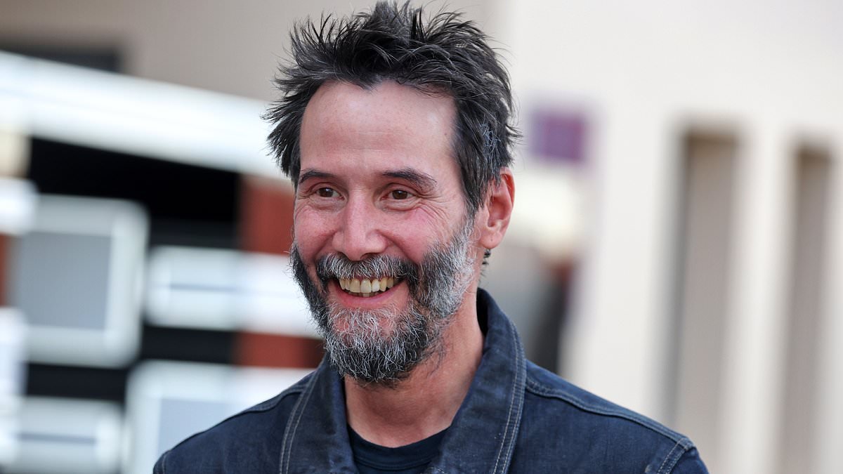 Keanu Reeves looks noticeably different as he sports spiky hair and a thick grey beard at Formula 1 pre-season testing in Bahrain