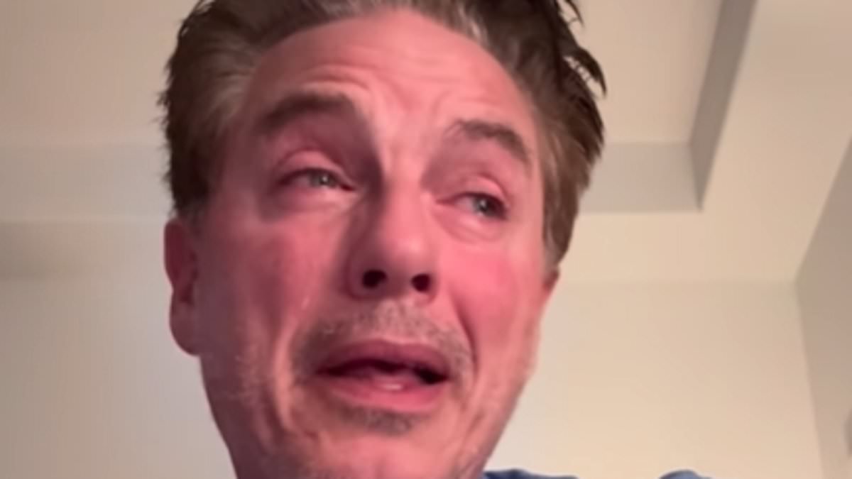 John Barrowman breaks down in tears while cradling his dog's body after the beloved pet 'waited until I got home' before dying peacefully in his arms