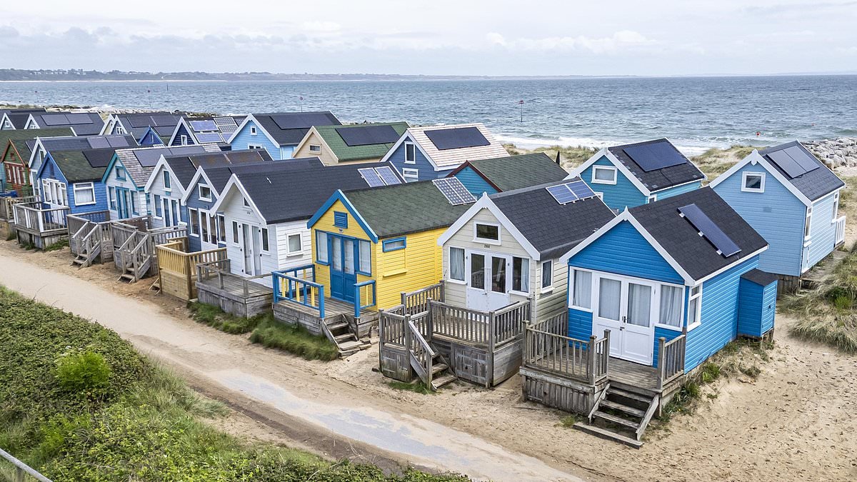 Furious beach hut owners threaten legal action over decision to charge them full council tax because they are 'second homes'