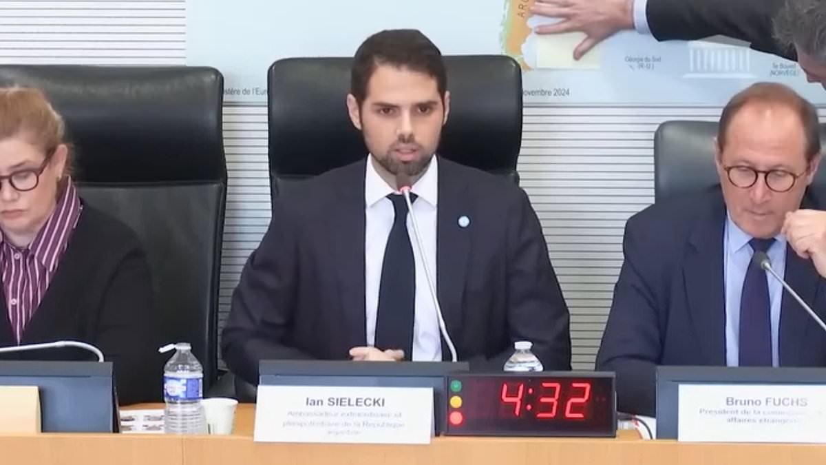 Argentina ambassador refuses to speak in front of map showing the Falklands labelled as British - before official covers it up with Post-it note