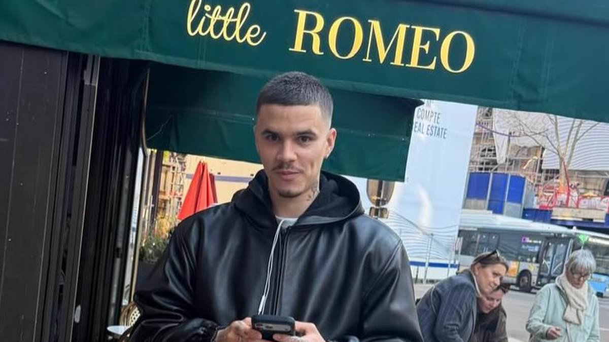 Romeo Beckham steps out in Paris for Fashion Week after extending an olive branch to estranged brother Brooklyn by sharing childhood snap of pair together to mark his 27th birthday