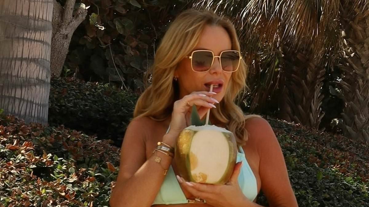Amanda Holden, 55, flaunts her jaw-dropping figure in a tiny bikini while hitting the beach amid sun-soaked family getaway
