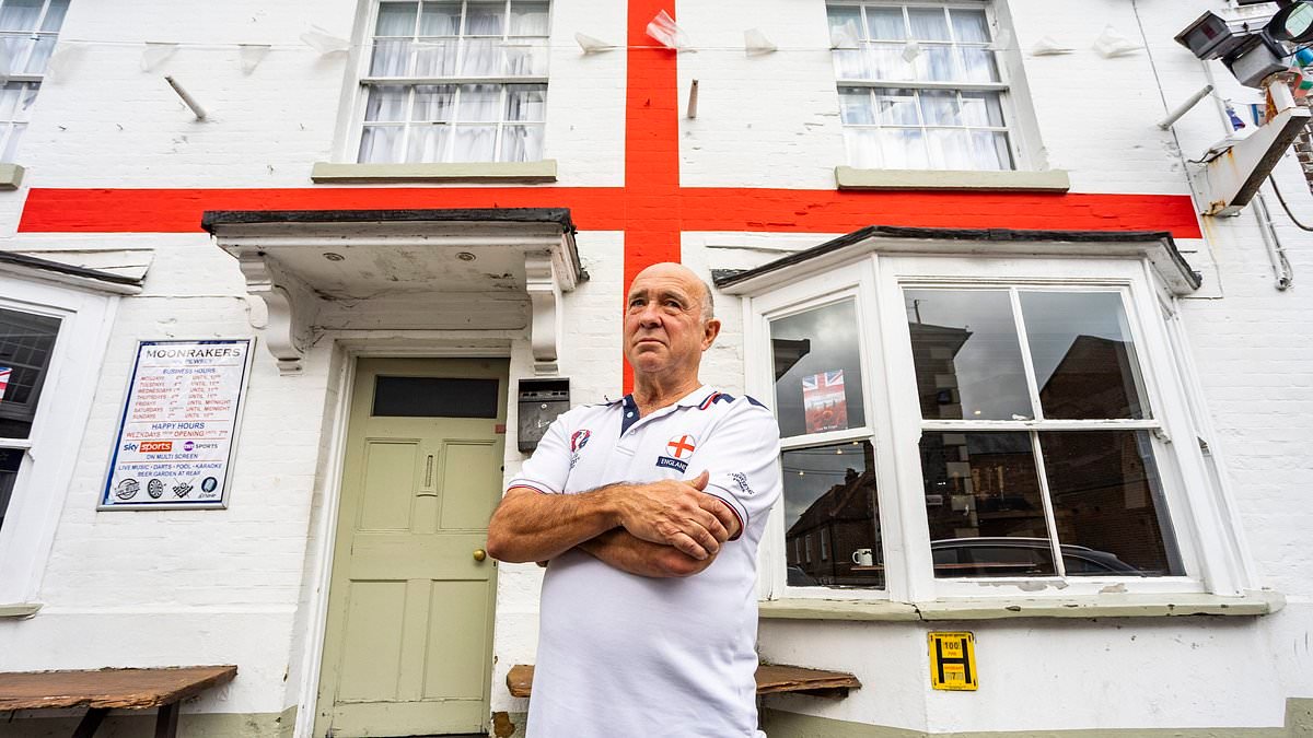 Patriotic pub landlord wins battle to keep giant St George's cross on venue - after ONE person complained