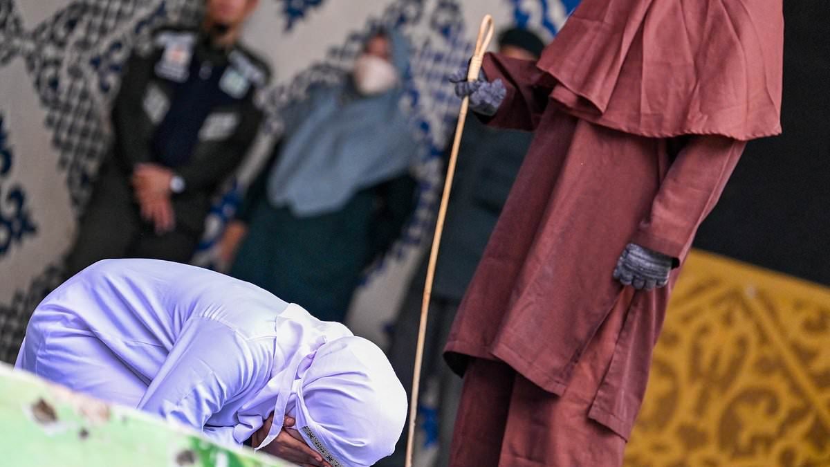 Unmarried couple who had sex receive an agonising 100 lashes each as part of Sharia Law group caning punishment which saw one woman whipped until she fell unconscious