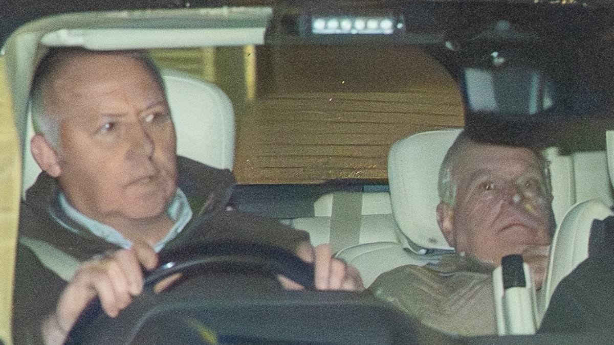 Now you see him, now you don't: Cringeworthy new photos show Andrew trying to hide from photographer as he's driven away by police