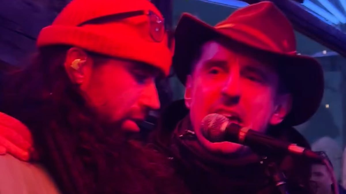 Gary Neville delights crowds with rock rendition of Livin' on a Prayer at luxury ski resort club - as he remains tight-lipped over Jim Ratcliffe's 'colonised by migrants' comments