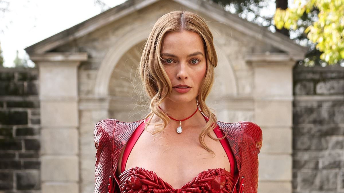 Is this Margot Robbie's most bizarre look yet? Wuthering Heights star opts for risque take on medieval corset at promo event