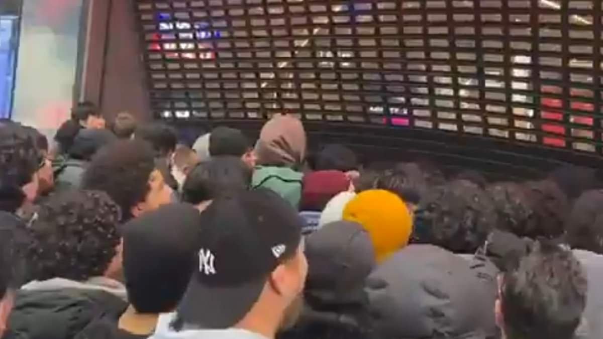 Moment crazed Pokemon fans force Sports Direct shutters open as they rush inside for new trading cards that can be worth thousands