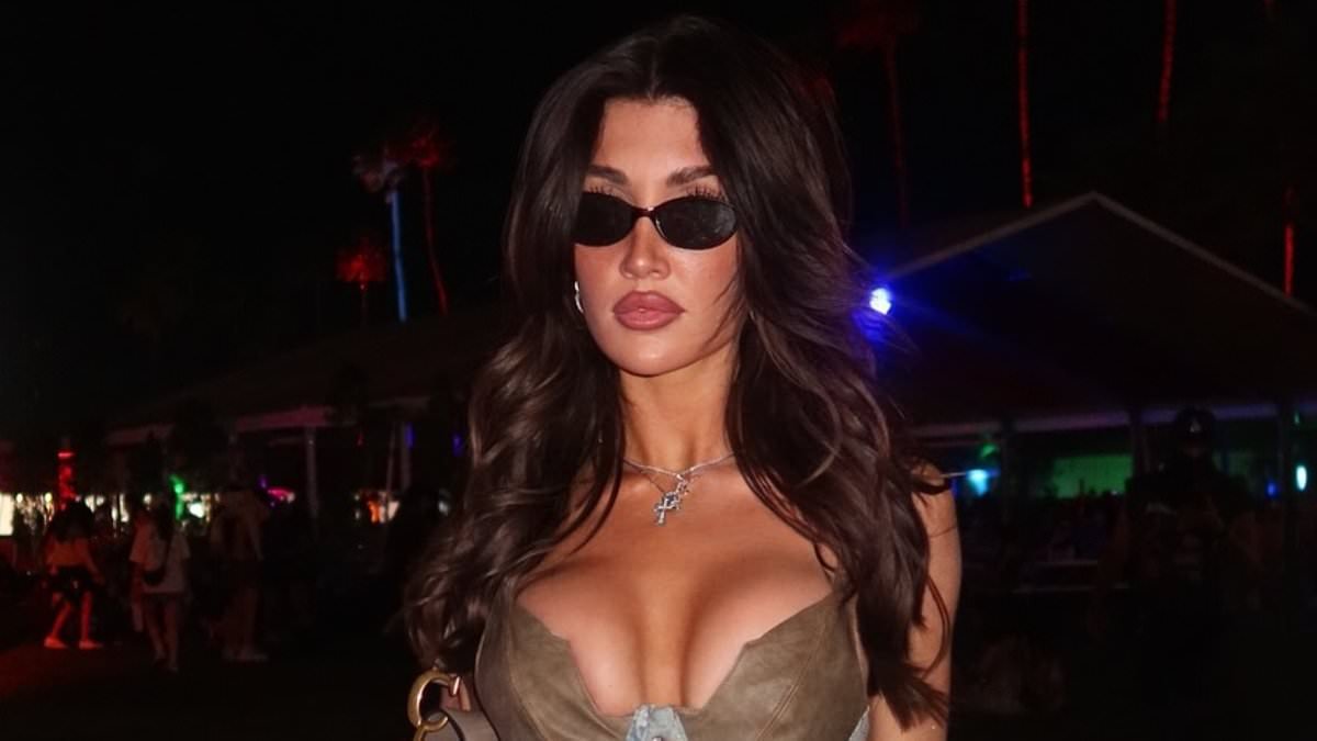 Liam Payne's girlfriend Kate Cassidy wears a VERY busty corset top and a tiny mini skirt as she attends Coachella