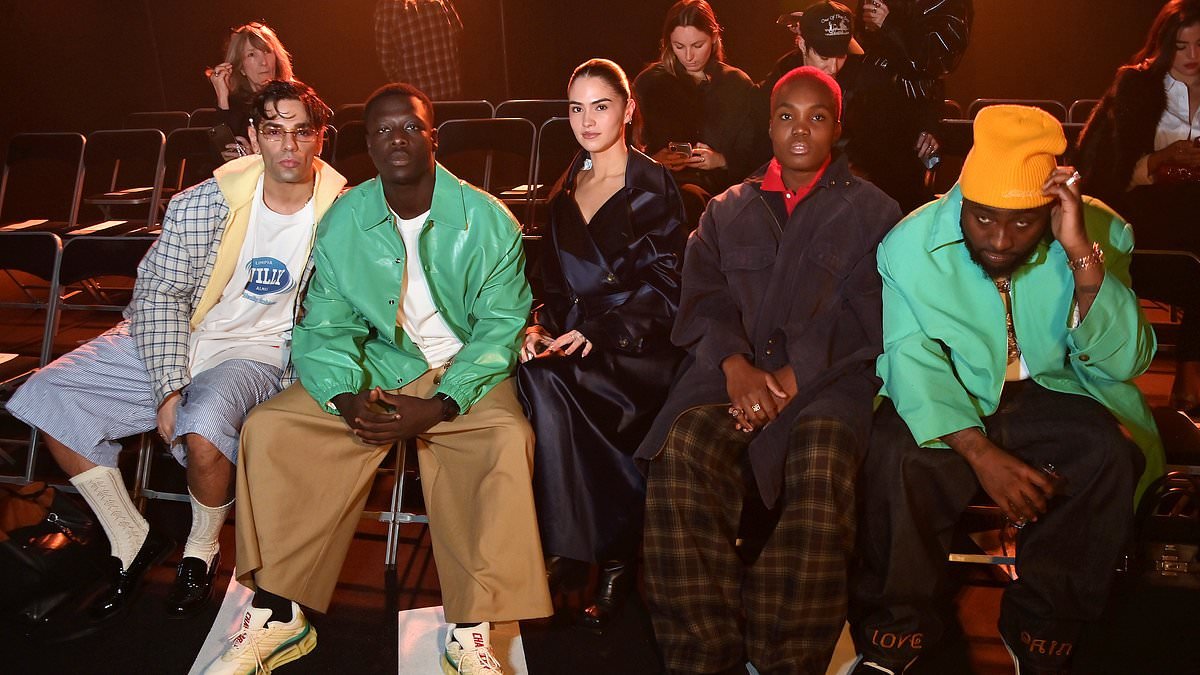 Move over Brooklyn and Nicola, it's Romeo's moment! Model walks in the Willy Chavarria show at Paris Fashion Week as Kim Turnbull bags herself a seat in the FROW to watch her boyfriend amid Beckham family fall-out