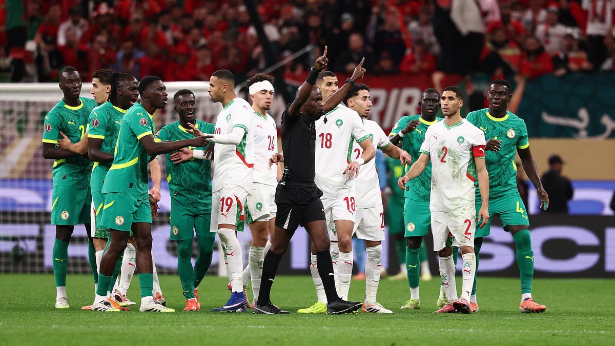 AFCON final descends into CHAOS as Senegal boss calls his team off the pitch after controversial late penalty is awarded to Morocco by VAR
