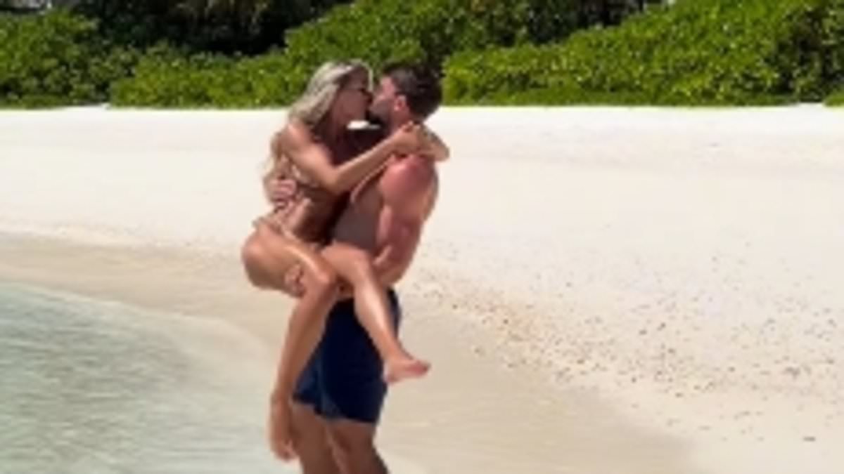 Love Island's Molly Smith shows off her washboard abs in a tiny bikini as she passionately kisses fiancé Tom Clare in the Maldives