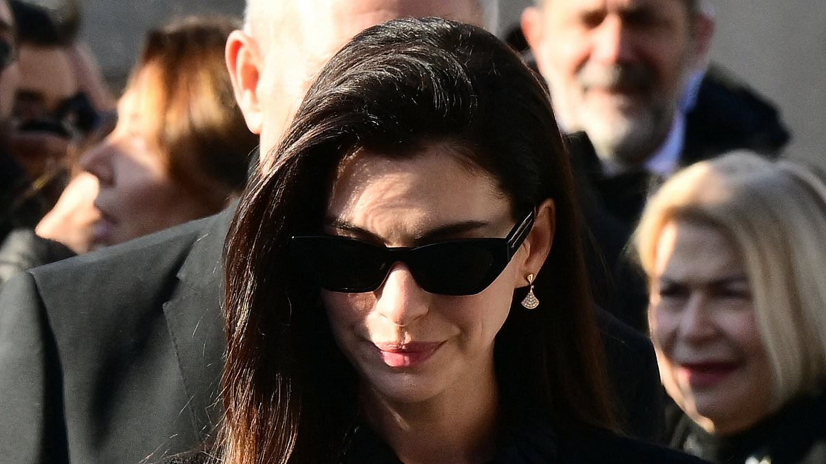 Anne Hathaway, Donatella Versace and Tom Ford cut sombre figures as they lead mourners paying tribute to Valentino Garavani at his funeral in Rome following his death aged 93