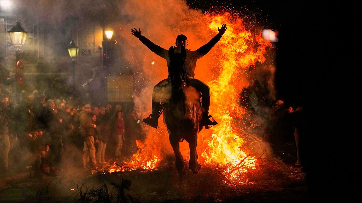 Hundreds come together to watch centuries-old tradition of horses galloping through flames in Spain