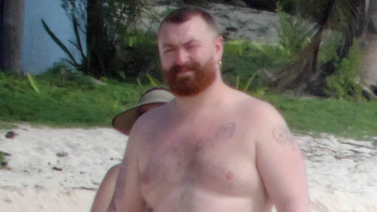 Shirtless Sam Smith shows off their tattooed torso as friend rubs sunscreen into their back for day by the sea following concert in Mexico