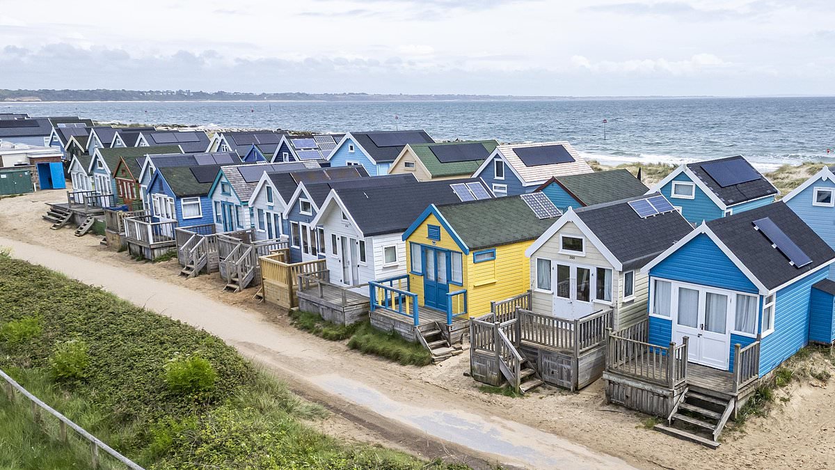 Owners of Britain's most exclusive beach huts face 50% council tax increase after penny-pinching council reclassifies them as second homes