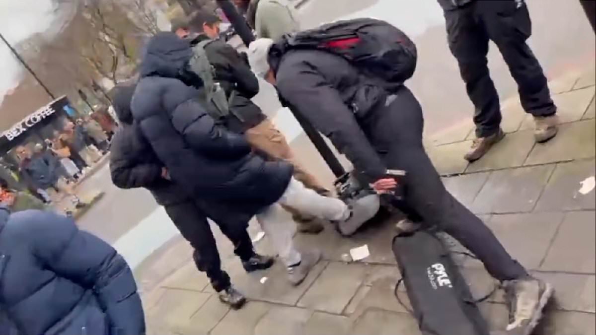 Moment Christian preacher is pushed by masked man and has his equipment attacked after being confronted by Muslim men in Whitechapel