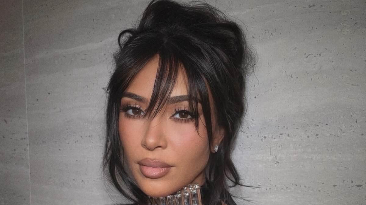 Kim Kardashian's new look for Lewis Hamilton! Star channels Pamela Anderson for 90s-loving F1 date with fake bangs and oversized choker for public debut at Super Bowl