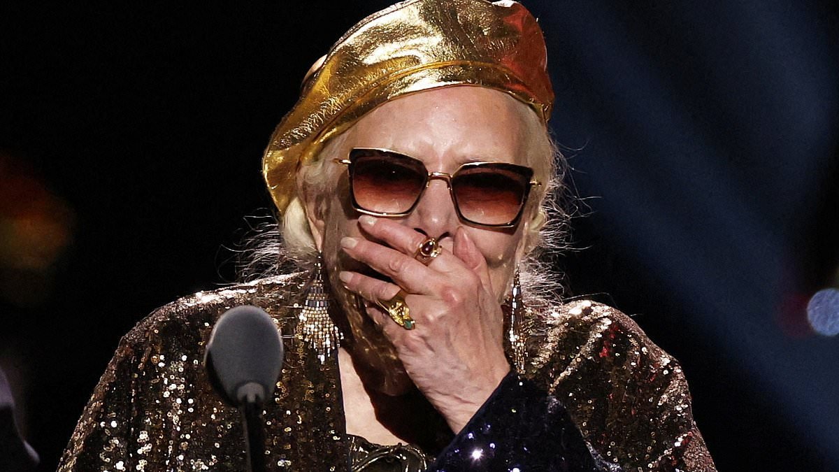 Joni Mitchell, 82, lapses into long pause in speech at 2026 Grammy Awards and then asks: 'Oh, I won?'