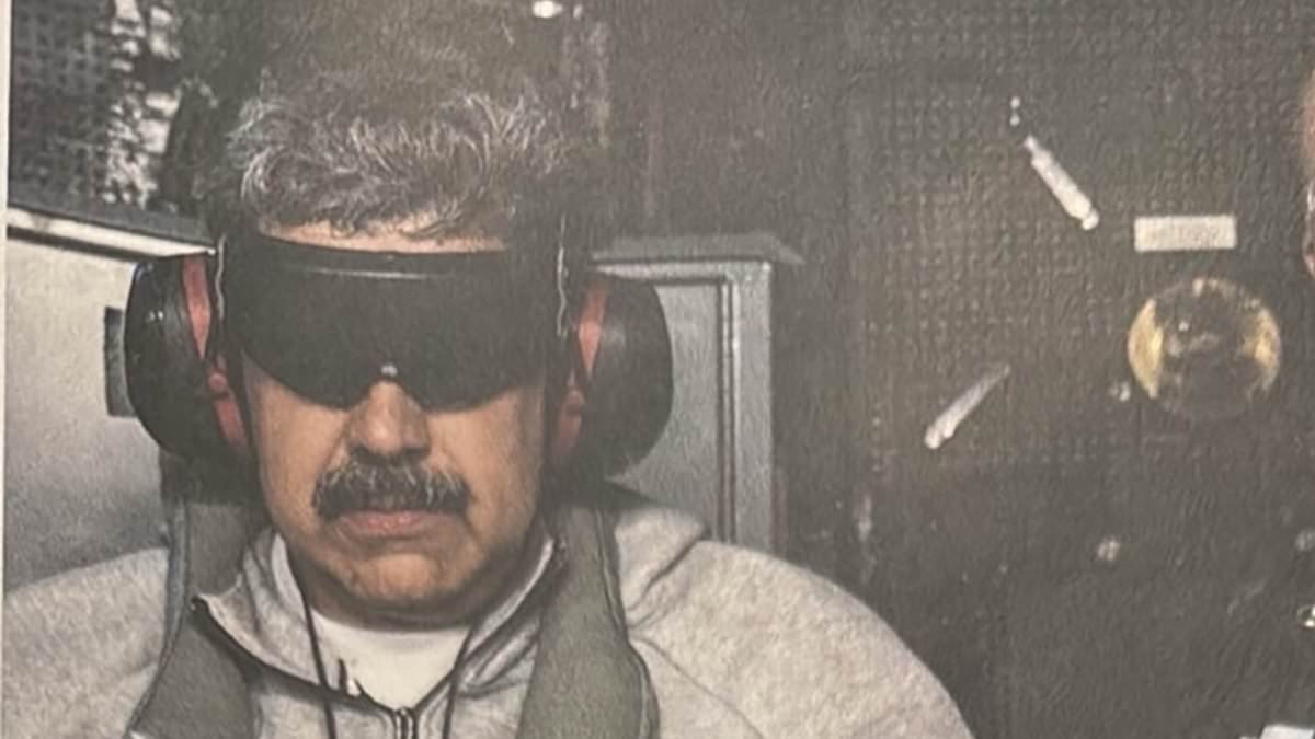 Trump shares humiliating photo of Maduro in TRACKSUIT with his eyes and ears covered and says Venezuelan president's wife will also be charged