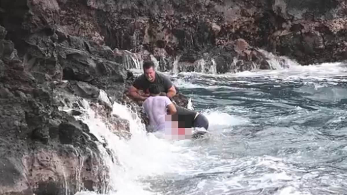 Heartbreaking photo shows moment young Hawaii father was almost rescued after jumping off cliff and struggling in ocean...before rogue wave swept him to his death