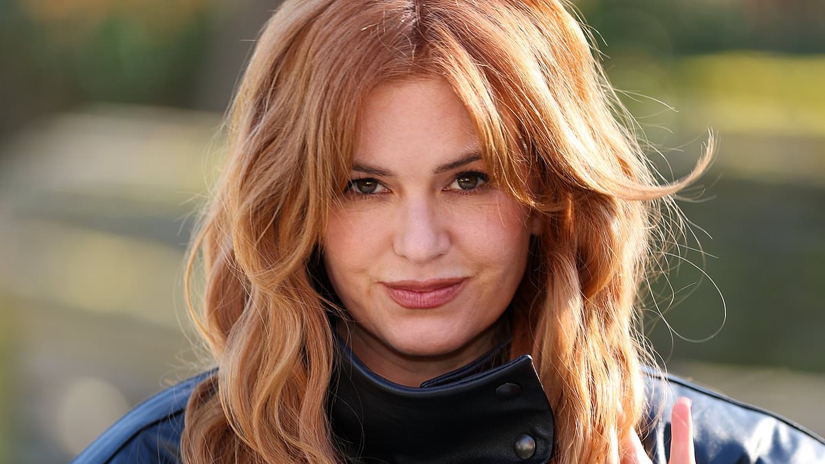 Isla Fisher puts on a leggy display in a leather jacket as she leads the stars at the Stella McCartney show during Paris Fashion Week
