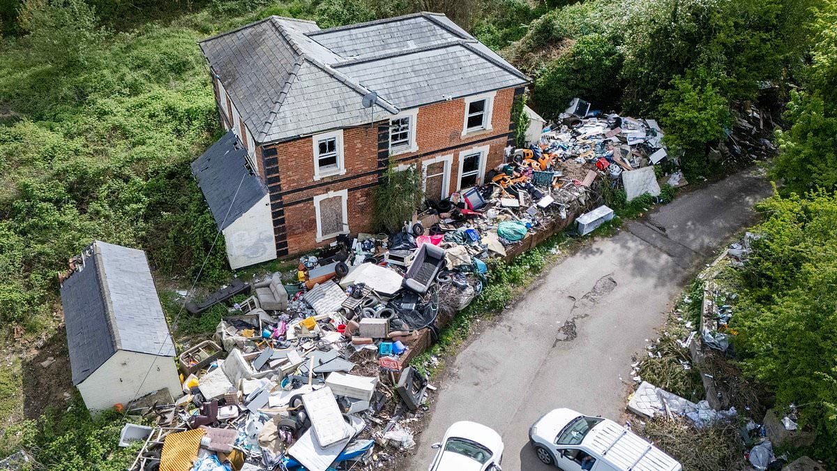 What an eyesore! Fly-tippers target former railway station by dumping five-foot wall of rubbish as locals hit out at 'abhorrent mess'