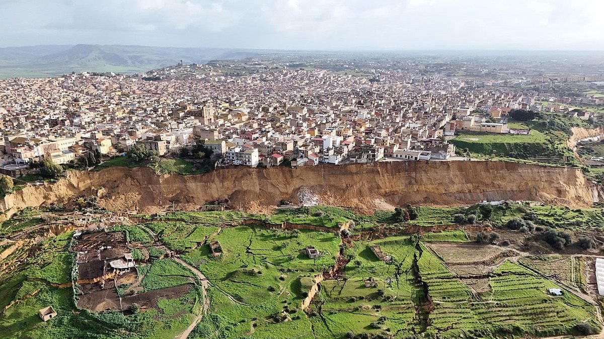 New images show incredible devastation to hit Sicilian town after landslide left houses perched on cliff edge, forcing 1,500 people to evacuate