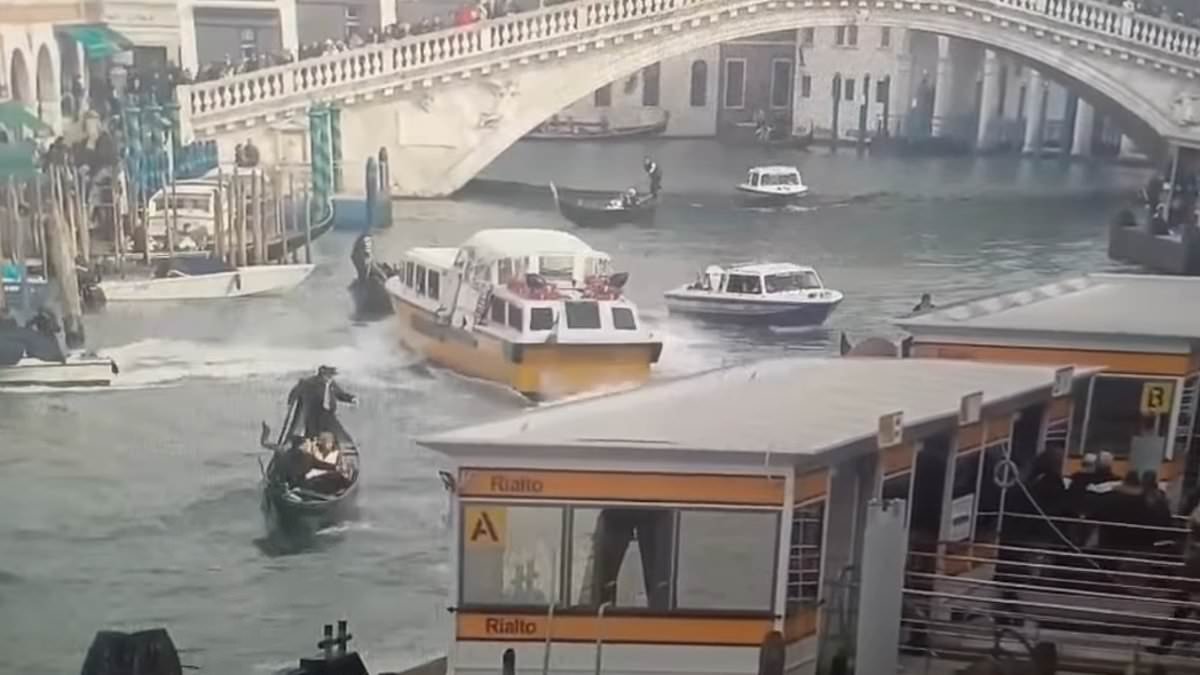 Moment malfunctioning ferry slams into gondola throwing holidaymakers into the water before crashing head-on into historic building in Venice's Grand Canal