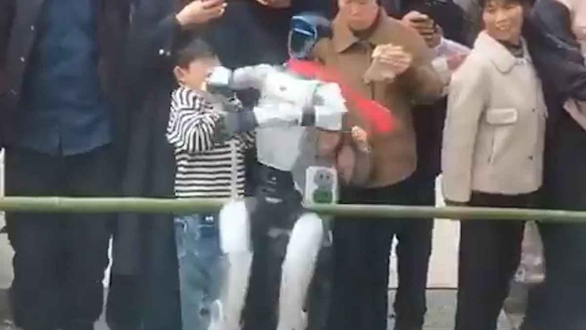 Robot dance show ends in DISASTER: Watch the horrifying moment a young boy is slapped across the face by a rogue humanoid as it performs a pirouette