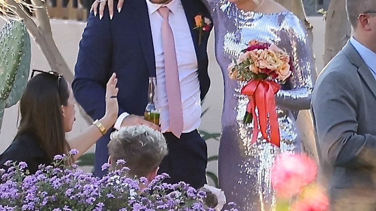 Jojo Siwa, 22, wows in a dazzling bridesmaid dress as she cuddles beer-swigging boyfriend Chris Hughes, 33, at her brother's Palm Springs wedding