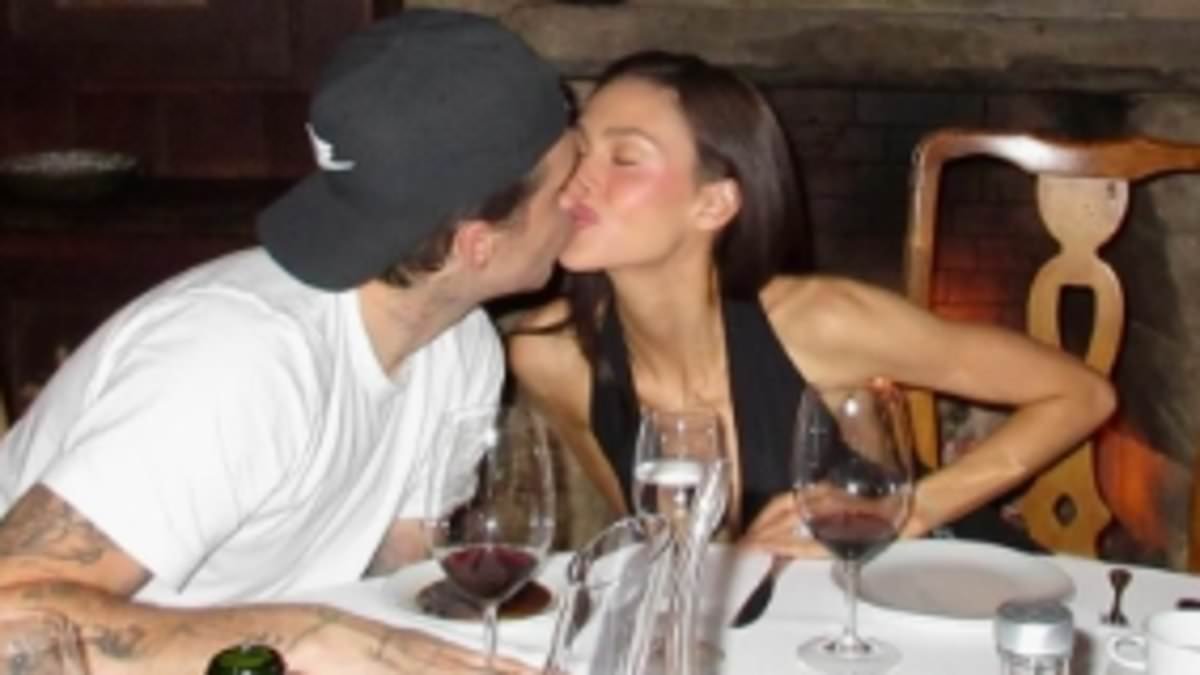 Brooklyn Beckham posts a racy snap of topless wife Nicola Peltz in bed - as it's revealed the actress 'could barely speak mother-in-law Victoria's name' when addressing THAT wedding dress row