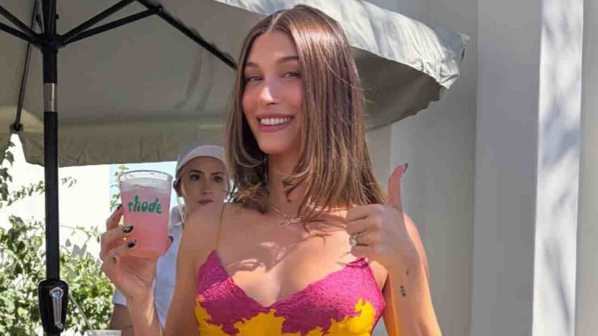 Hailey Bieber cuts loose at Coachella with tequila cocktails and hamburgers while modeling a negligee dress