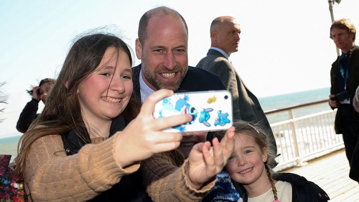 Prince of the pier! William poses for selfies during sunny stroll on visit to Bournemouth