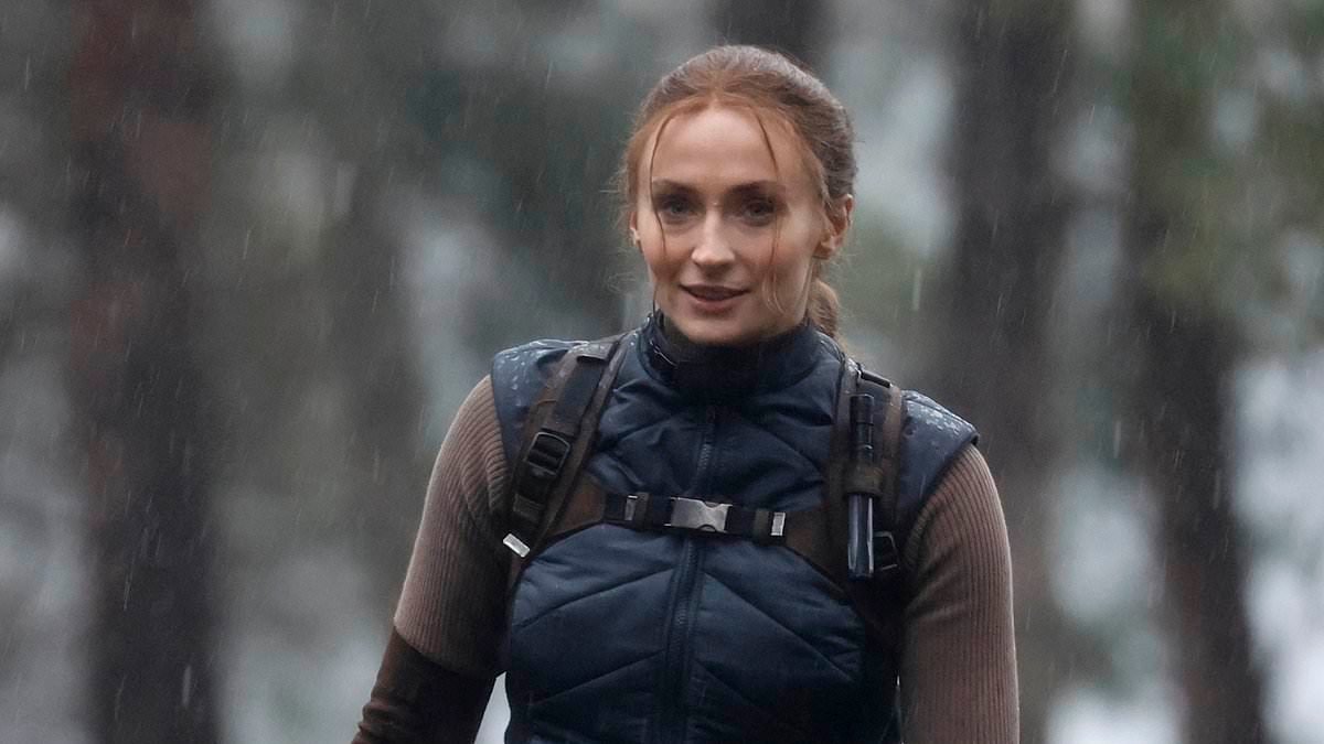 Sophie Turner braves the rain and soars over a lake as she performs her own stunts in first sighting on the set of Tomb Raider