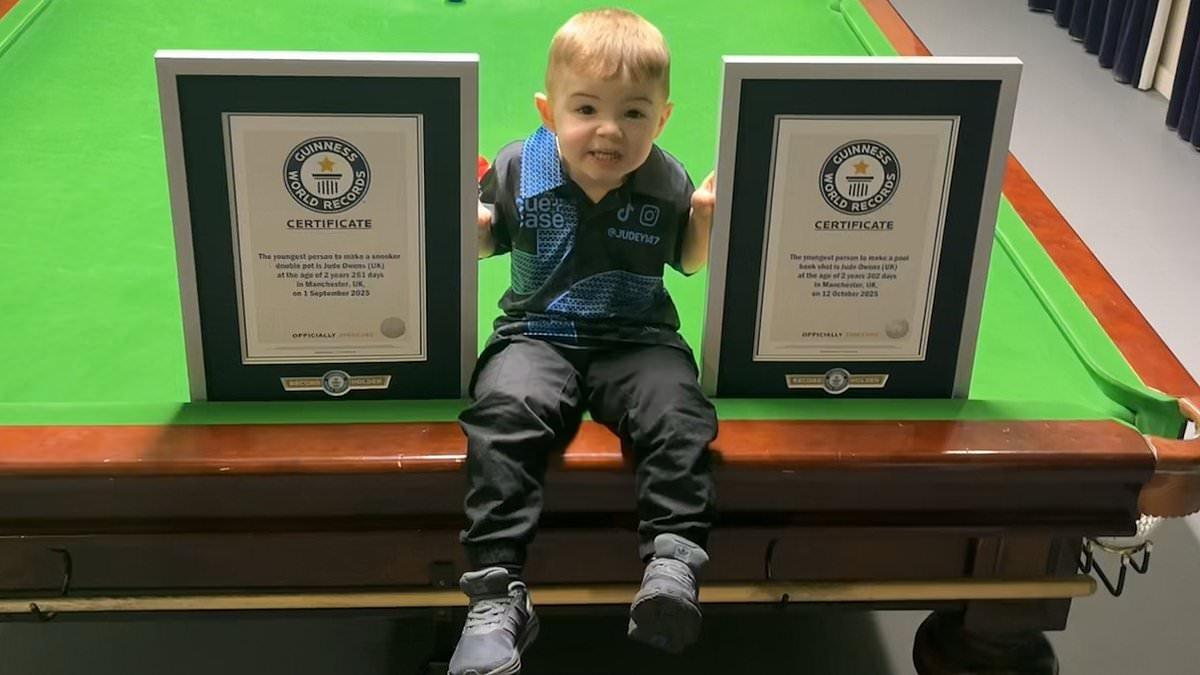 Snooker prodigy, two, lands Guinness World Records by becoming the youngest person to nail TWO trick shots