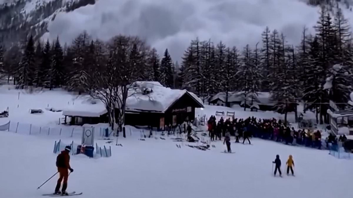 Moment avalanche cascades down mountain in Italy as dozens of skiers watch on - before desperately trying to flee